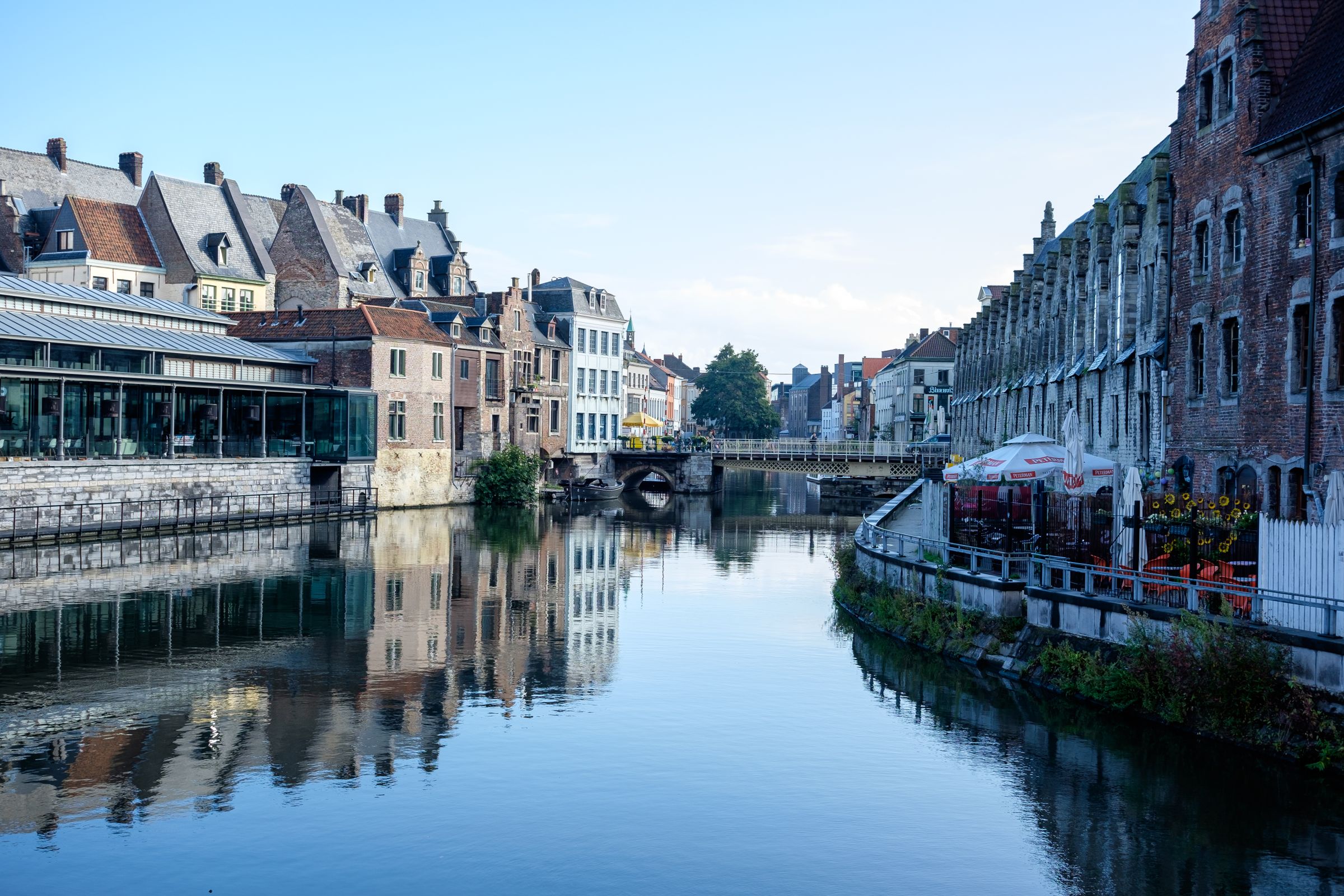 Historic buildings reflected in a Ghent canal