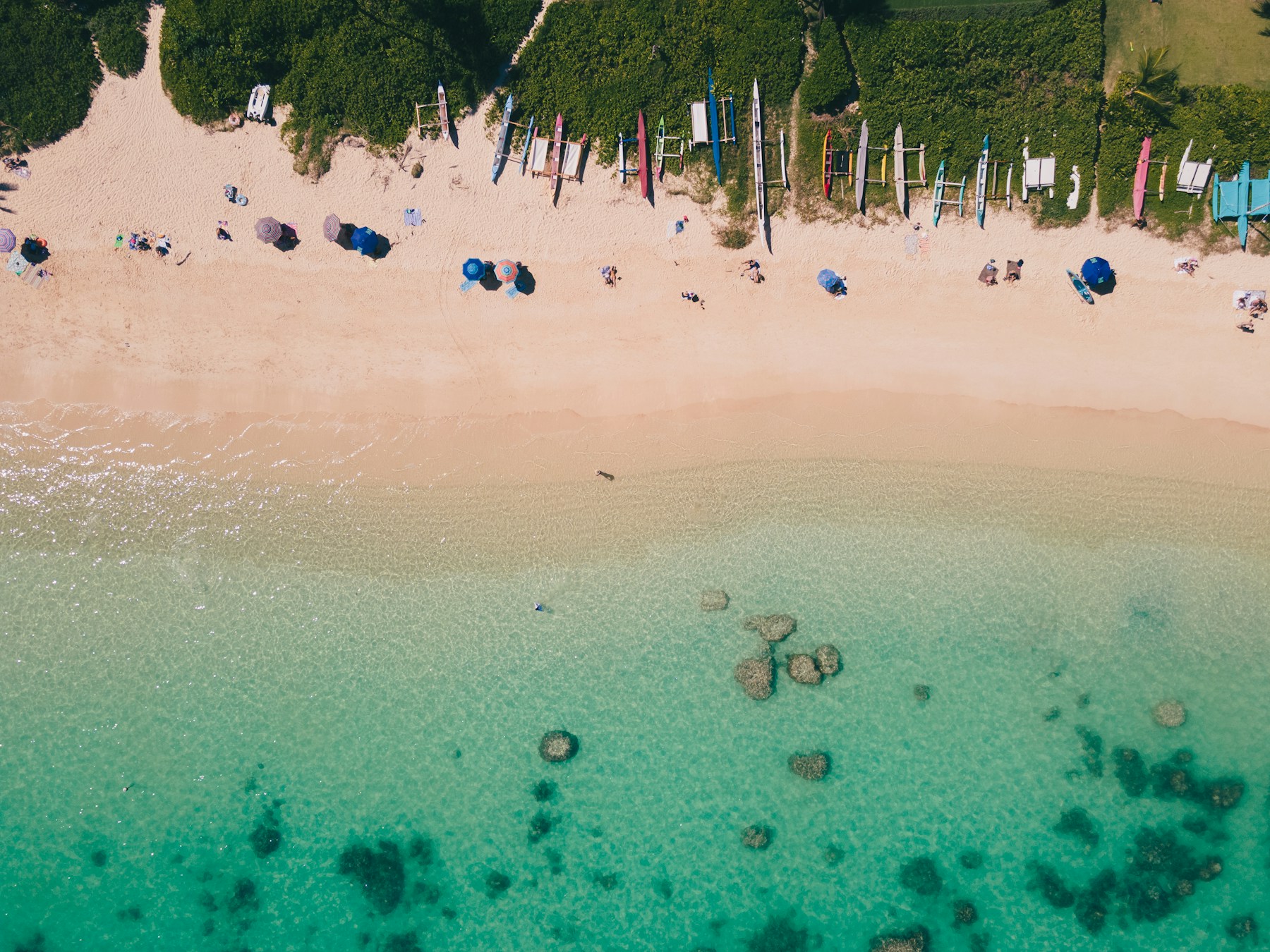 Turquoise water, beach and canoes at Lanikai on Oʻahu’s windward coast